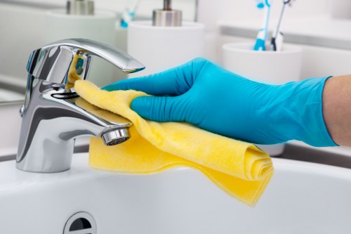 Experienced staff at Harrys Cleaners handling delicate garments
